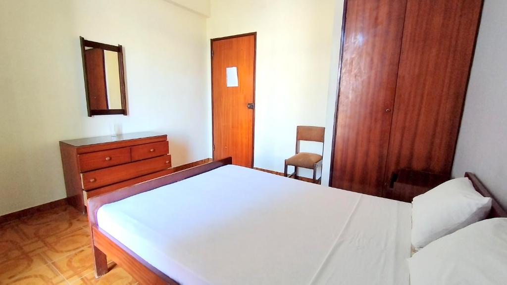 Postel nebo postele na pokoji v ubytování Residencial Amarante