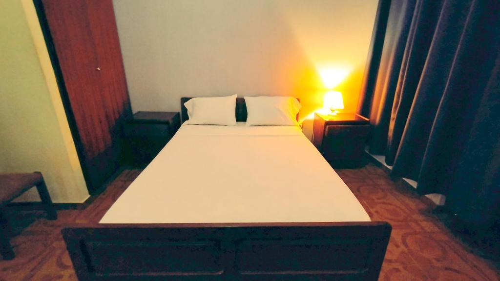 Postel nebo postele na pokoji v ubytování Residencial Amarante