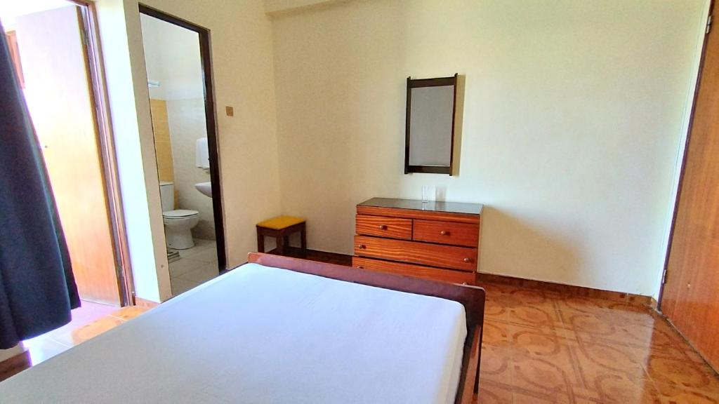 Postel nebo postele na pokoji v ubytování Residencial Amarante