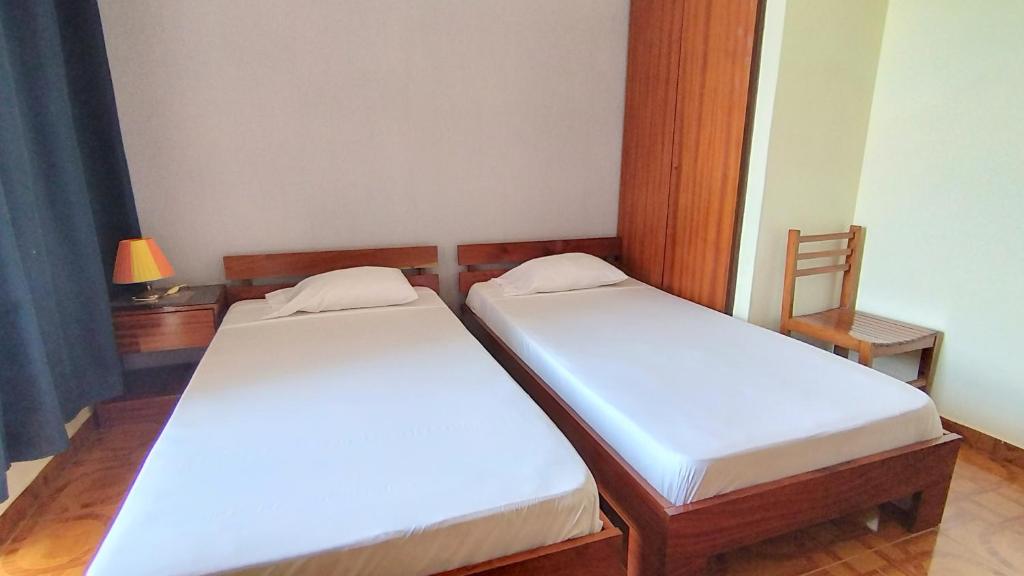 Postel nebo postele na pokoji v ubytování Residencial Amarante