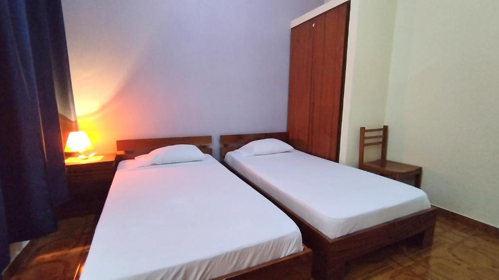 Postel nebo postele na pokoji v ubytování Residencial Amarante