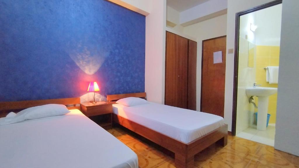 Postel nebo postele na pokoji v ubytování Residencial Amarante