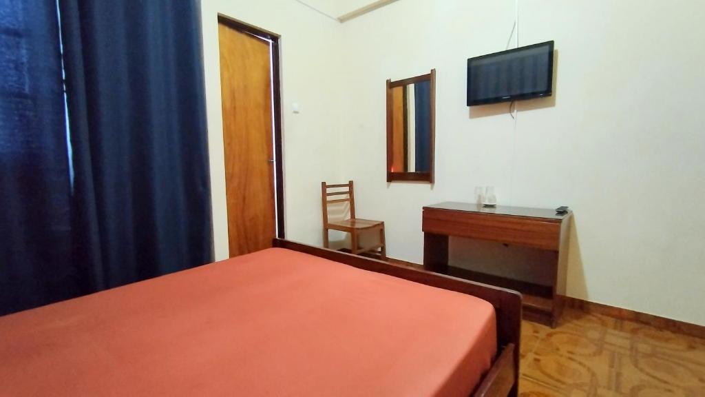 Postel nebo postele na pokoji v ubytování Residencial Amarante