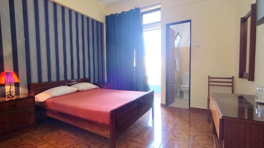 Postel nebo postele na pokoji v ubytování Residencial Amarante