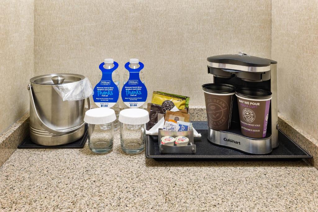 a tray with a coffee maker and other items on a counter at DoubleTree by Hilton Johnson City in Johnson City