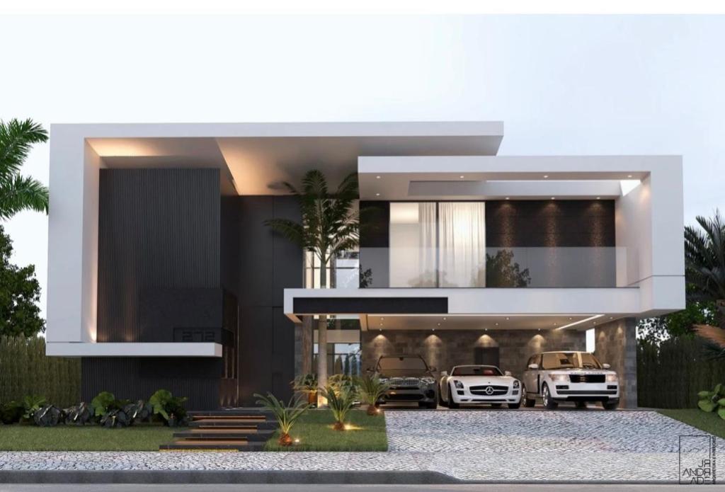 a modern house with two cars parked in the driveway at AAS HOSTS in Islamabad