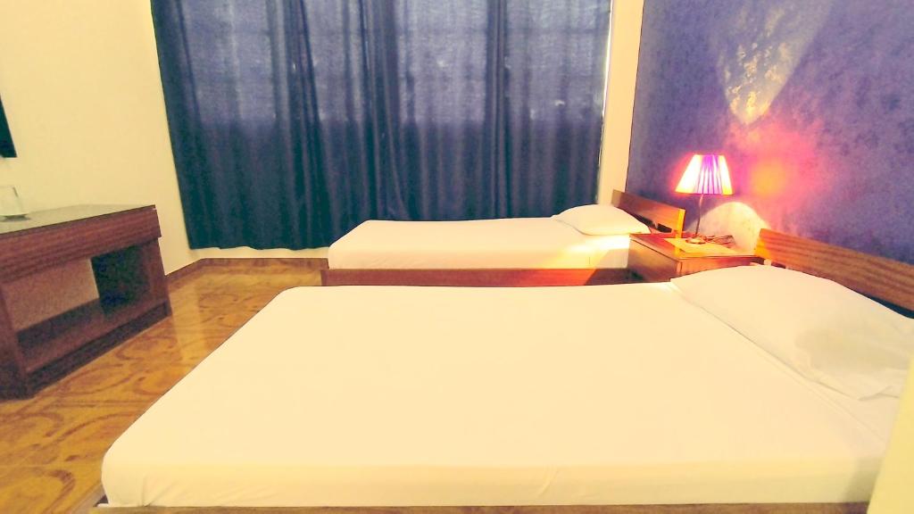 Postel nebo postele na pokoji v ubytování Residencial Amarante