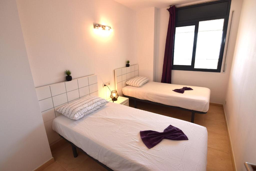 Posteľ alebo postele v izbe v ubytovaní Apartamento con piscina y vistas al mar ref 154