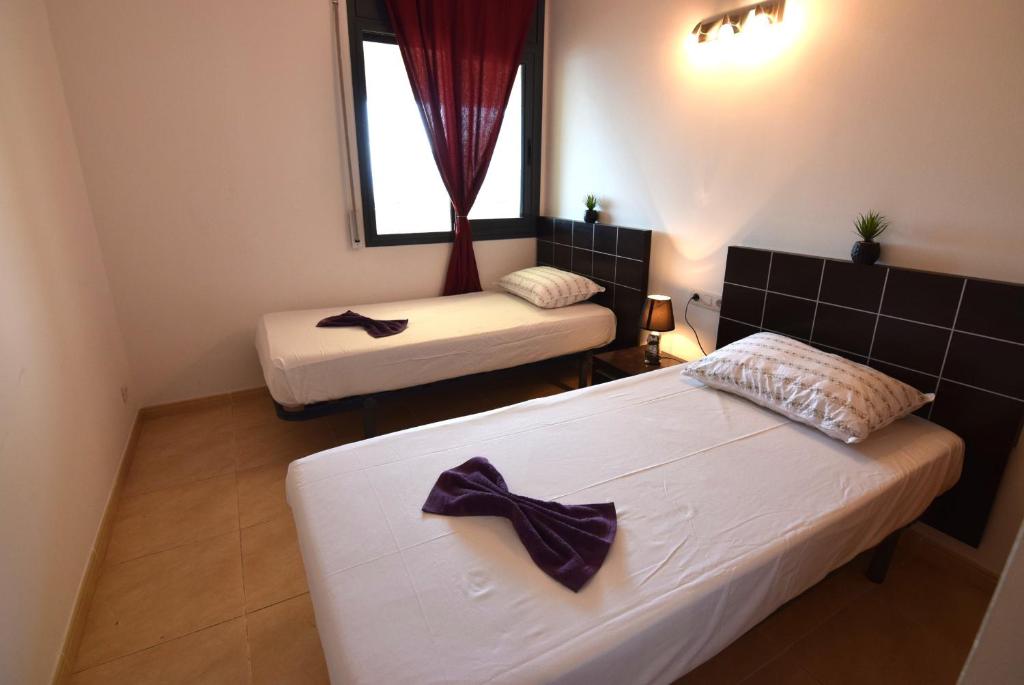 Posteľ alebo postele v izbe v ubytovaní Apartamento con piscina y vistas al mar ref 154