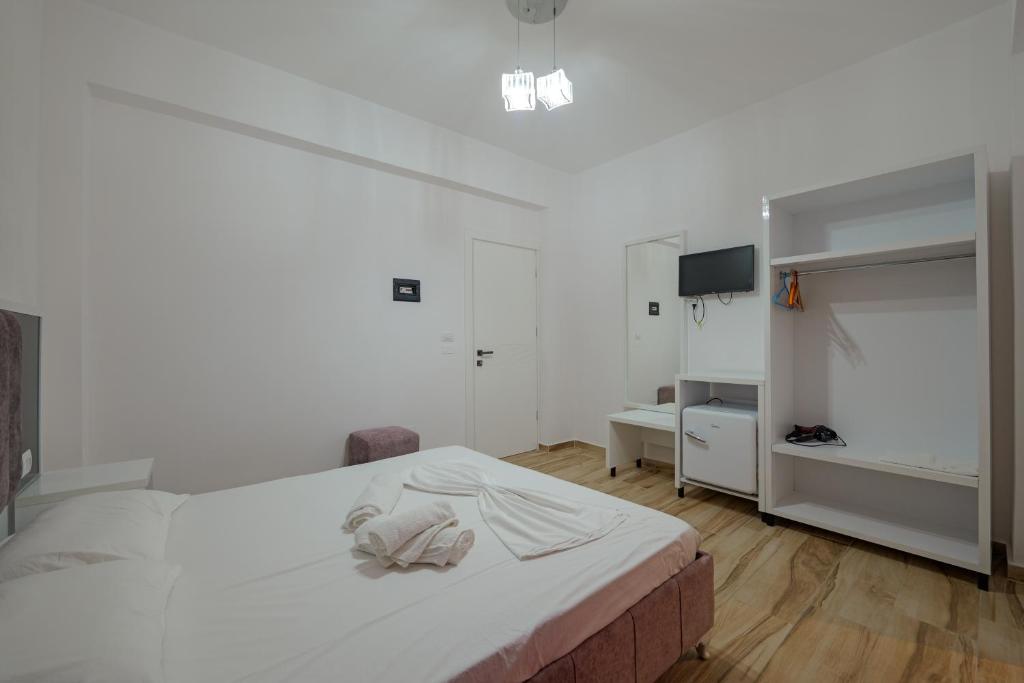 Postel nebo postele na pokoji v ubytování Hotel Take