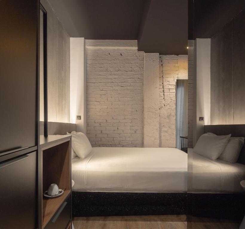 Postel nebo postele na pokoji v ubytování Hotel Tayko Bilbao