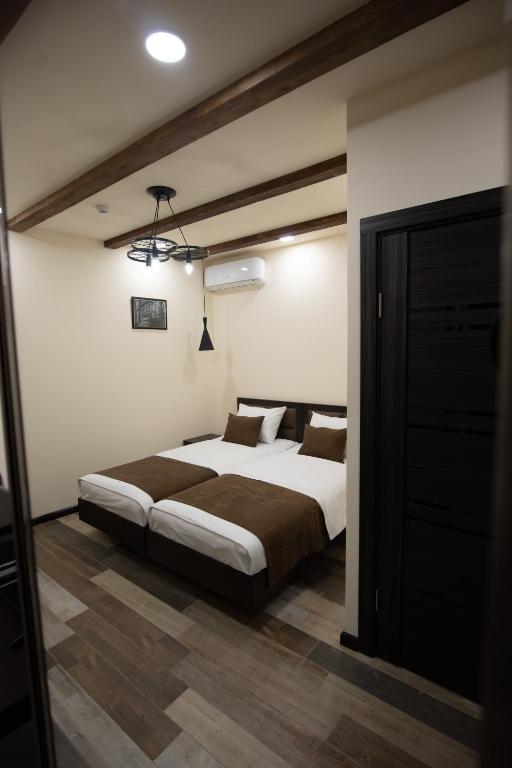 Postel nebo postele na pokoji v ubytování Boutique Living Hotel