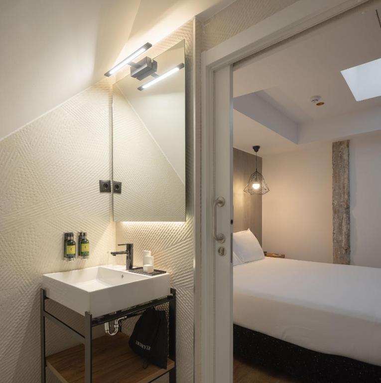 Postel nebo postele na pokoji v ubytování Hotel Tayko Bilbao
