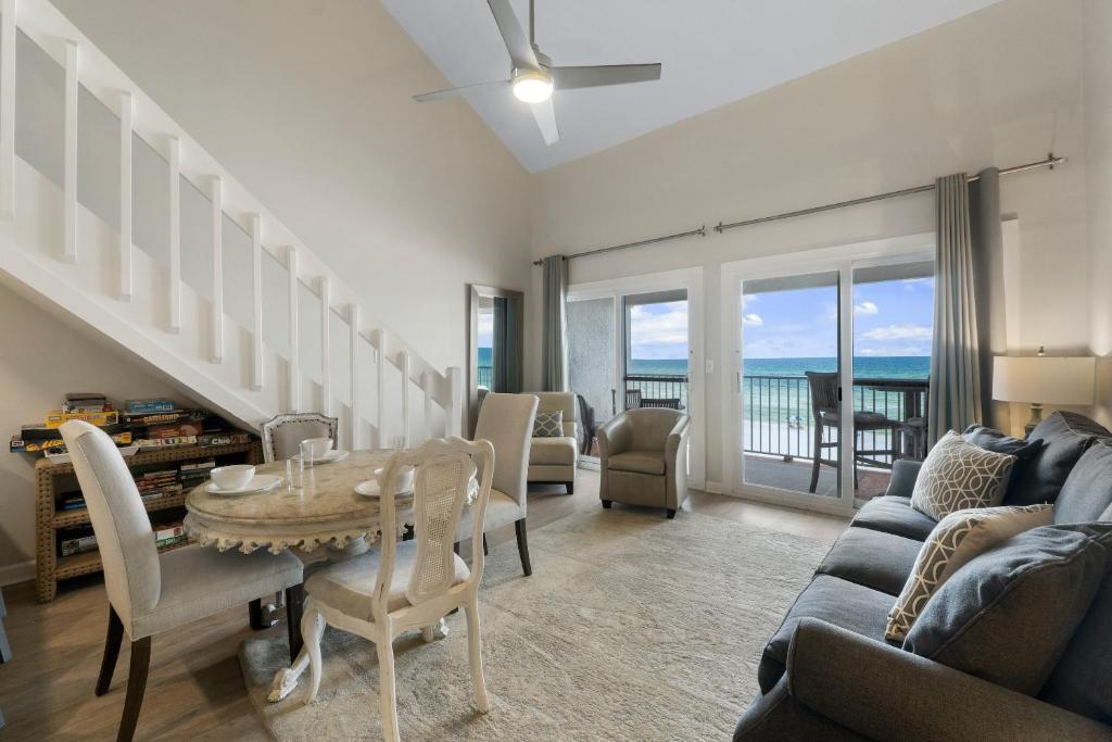 a living room with a table and a couch at Eastern Shores on 30A by Panhandle Getaways in Seagrove Beach