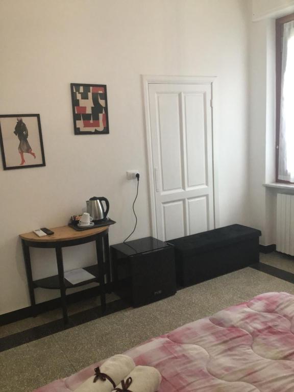 Łóżko lub łóżka w pokoju w obiekcie La Rosa Dei Venti