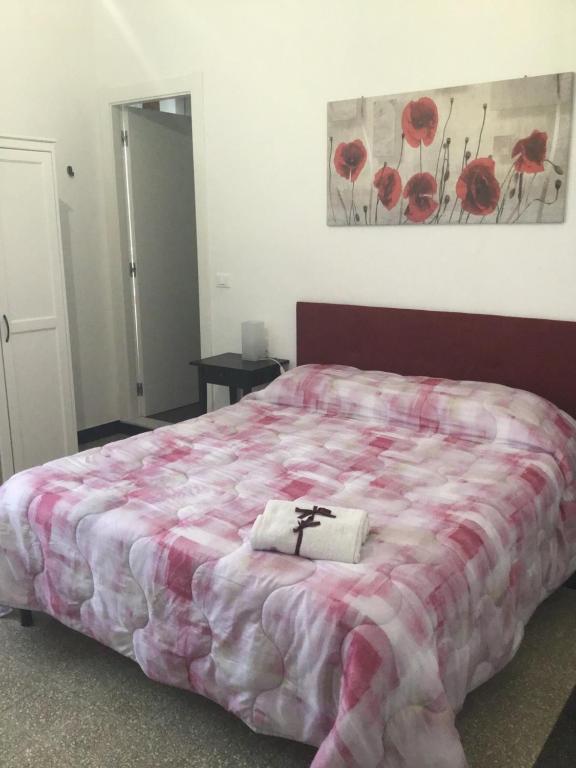 Łóżko lub łóżka w pokoju w obiekcie La Rosa Dei Venti