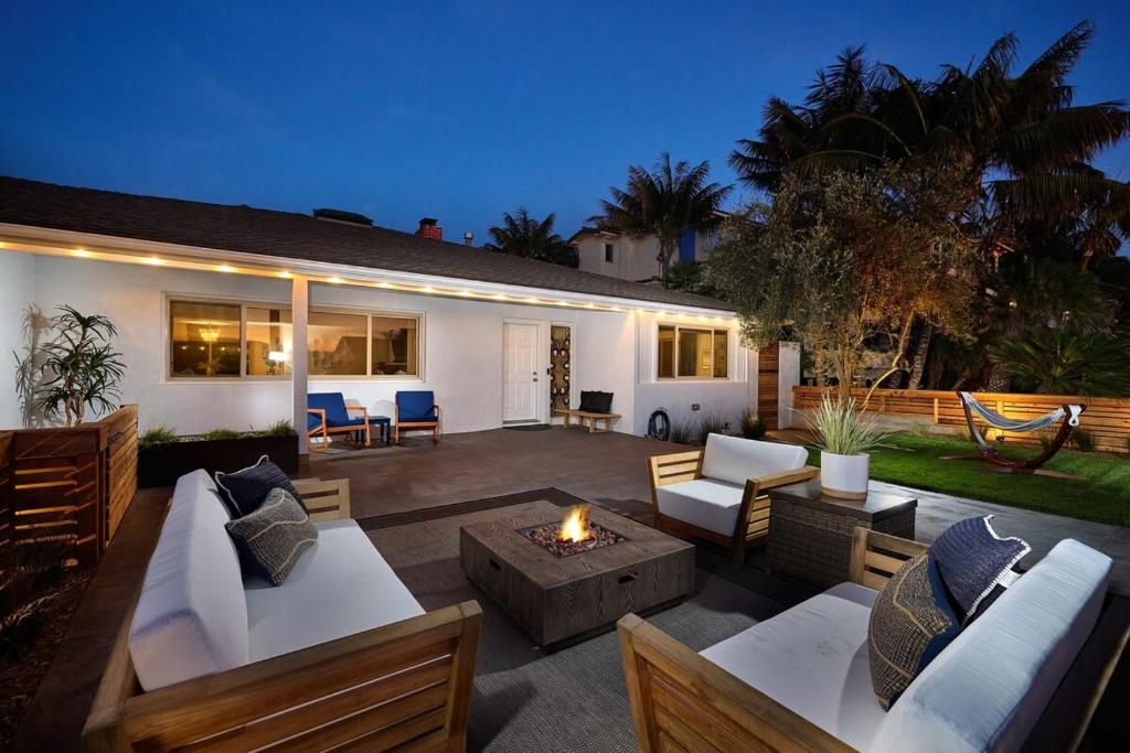 a patio with couches and a fire pit at Family Beach house in Carlsbad
