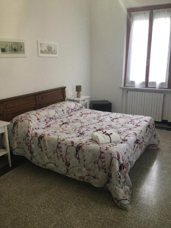 Łóżko lub łóżka w pokoju w obiekcie La Rosa Dei Venti