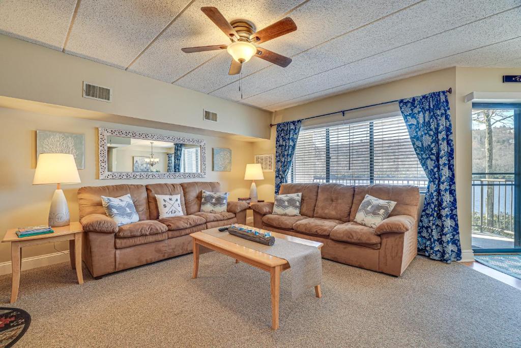 a living room with two couches and a ceiling fan at Lake Harmony Condo with Big Boulder Lake Views in Lake Harmony