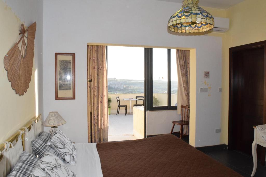 Katil atau katil-katil dalam bilik di Gmiel in-Natura B&B