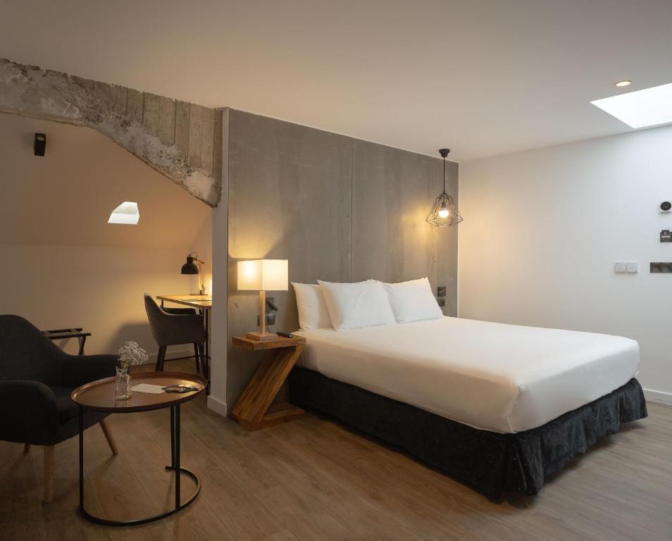 Postel nebo postele na pokoji v ubytování Hotel Tayko Bilbao