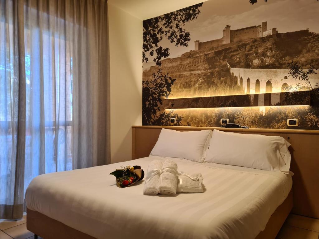 Postel nebo postele na pokoji v ubytování Hotel Cladan
