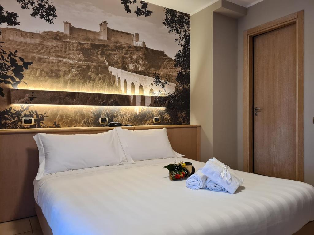 Postel nebo postele na pokoji v ubytování Hotel Cladan