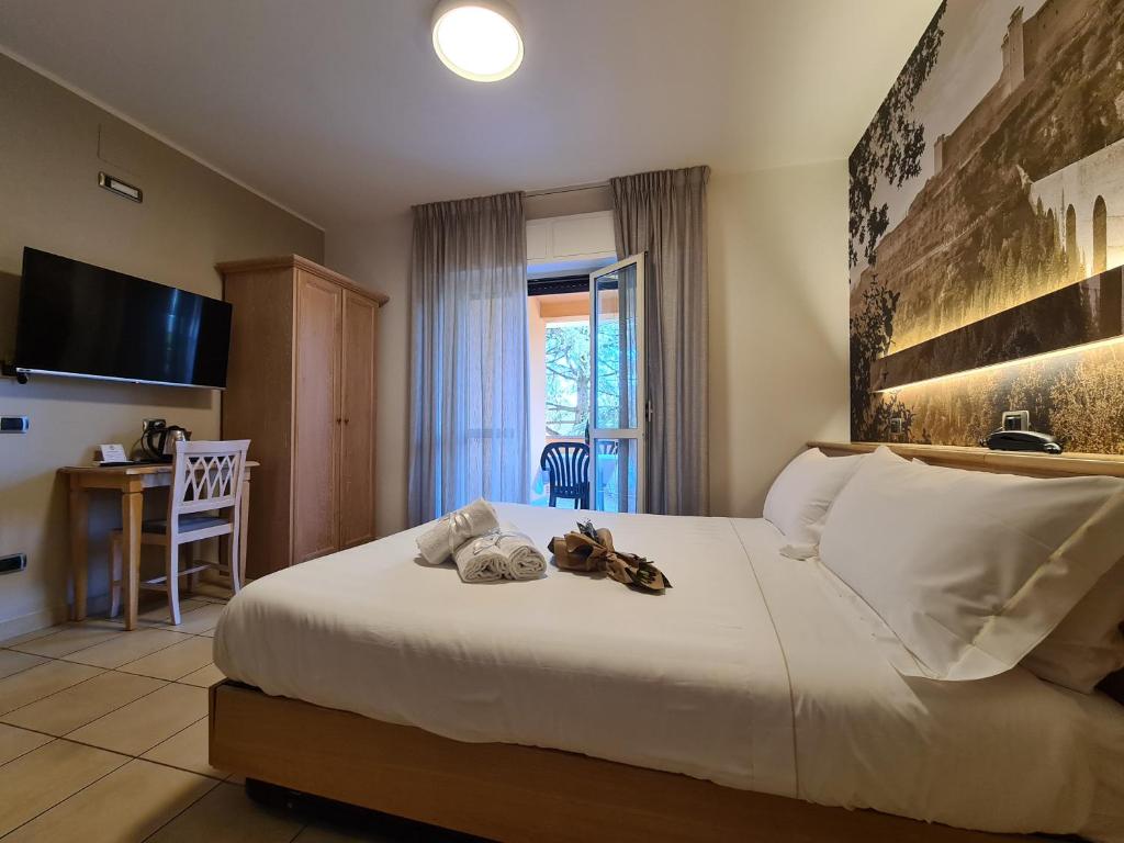 Postel nebo postele na pokoji v ubytování Hotel Cladan