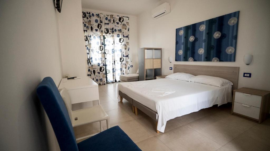 Postel nebo postele na pokoji v ubytování B&B L'Oasi