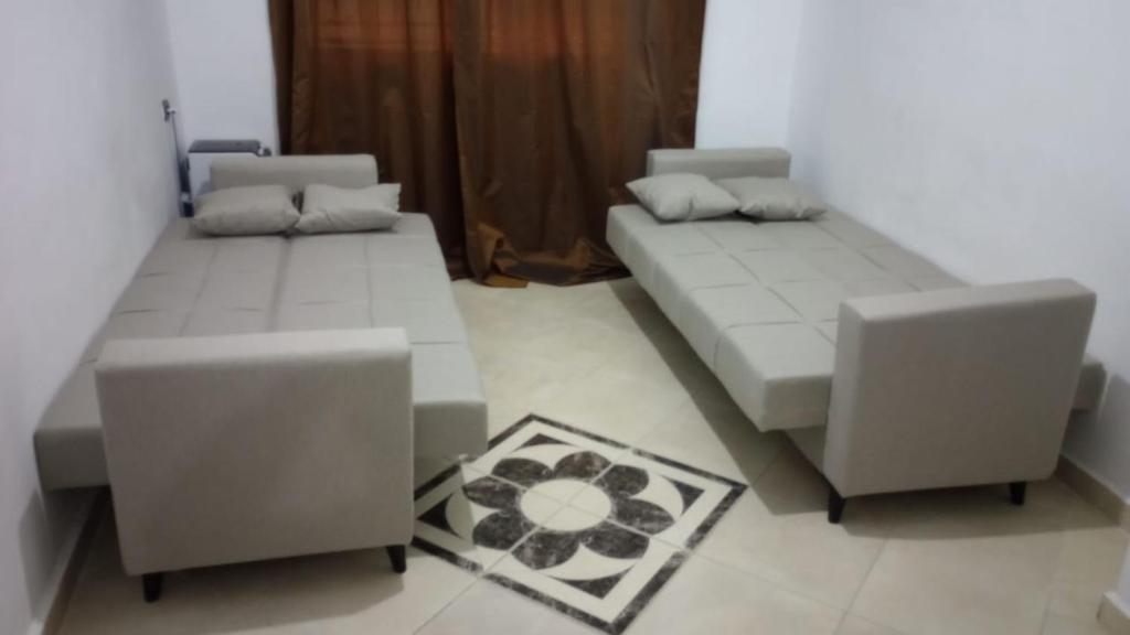 a living room with two couches and a couch at Apartment 20m from Martil beach in Tetouan