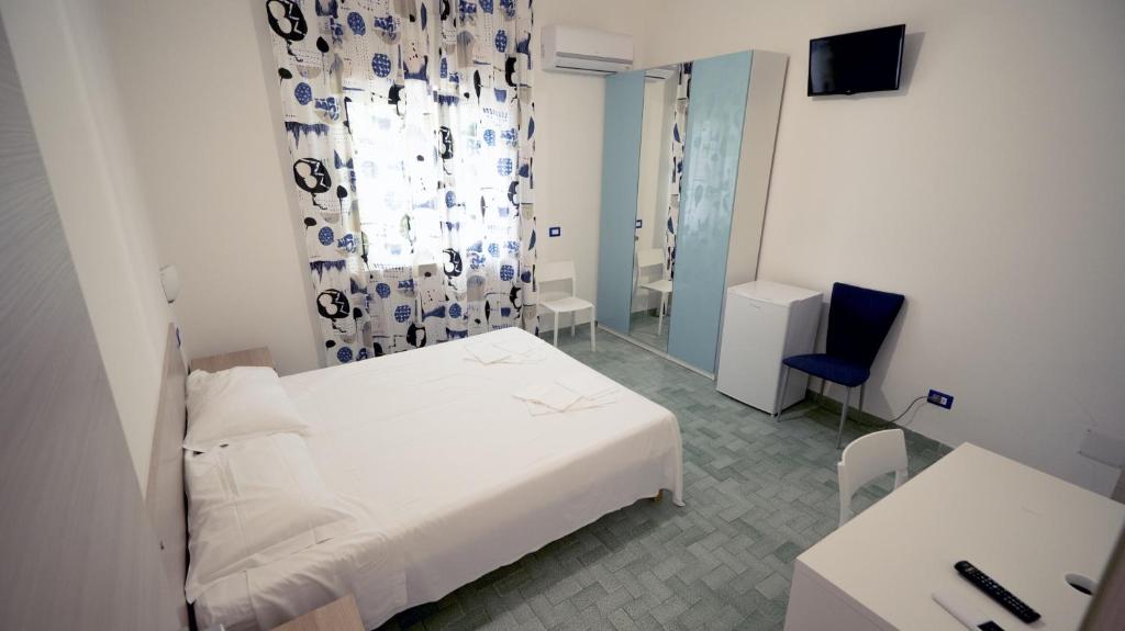 Postel nebo postele na pokoji v ubytování B&B L'Oasi