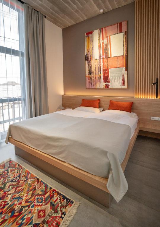 Postel nebo postele na pokoji v ubytování Erkan Alek Heritage Hotel