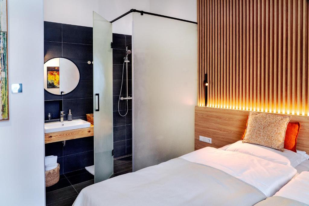 Postel nebo postele na pokoji v ubytování Erkan Alek Heritage Hotel