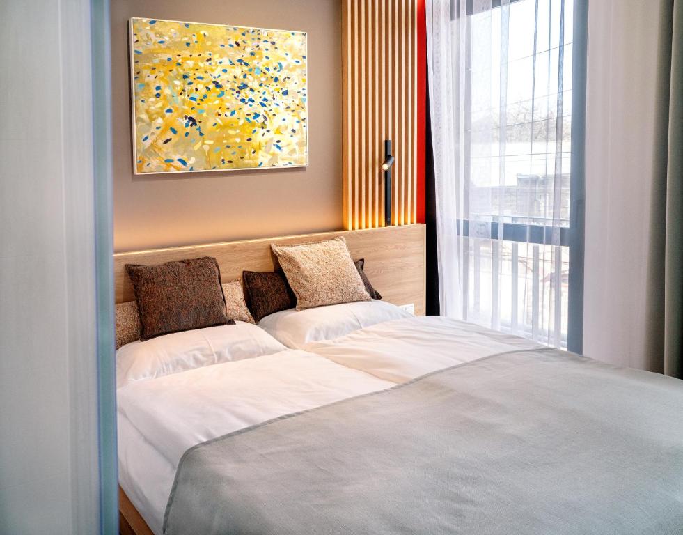 Postel nebo postele na pokoji v ubytování Erkan Alek Heritage Hotel
