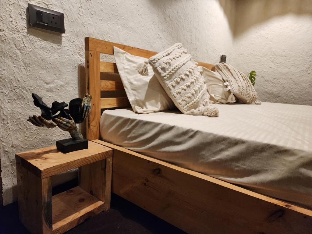 Postel nebo postele na pokoji v ubytování Mudhouse Bir