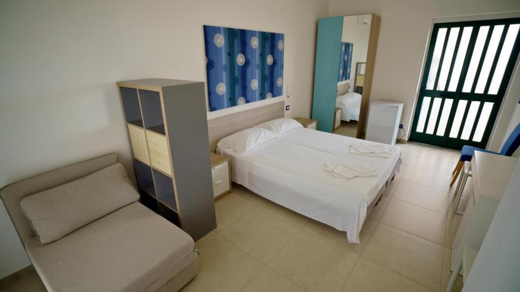 Postel nebo postele na pokoji v ubytování B&B L'Oasi
