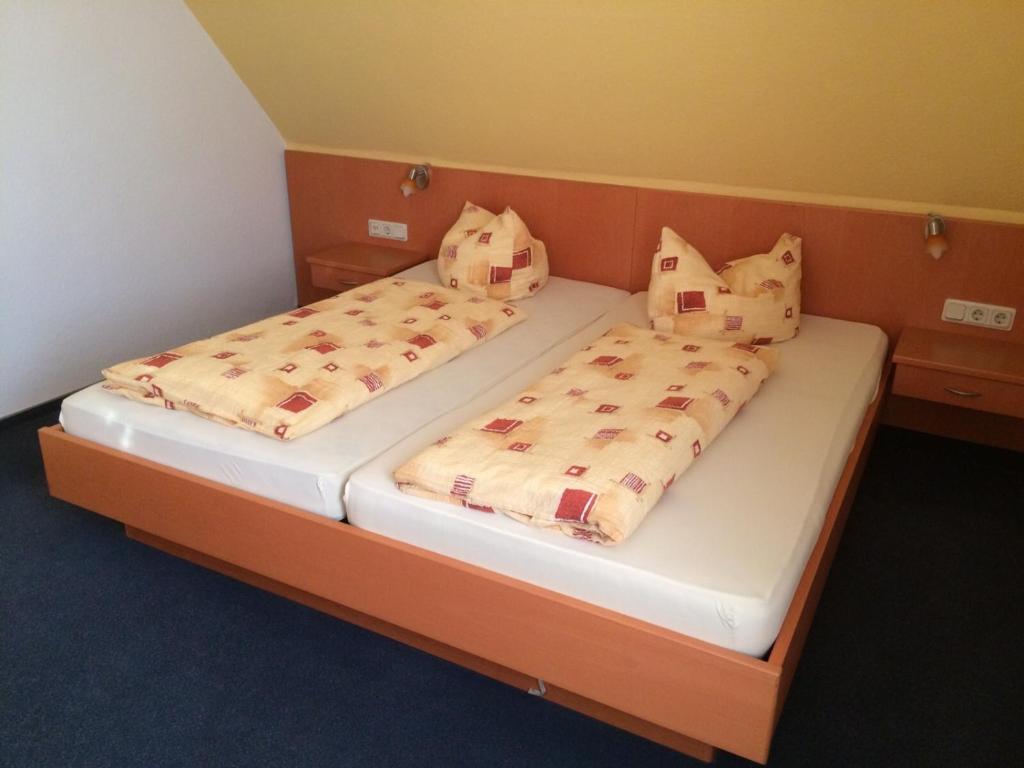 Postel nebo postele na pokoji v ubytování Hotel Am Salzberg