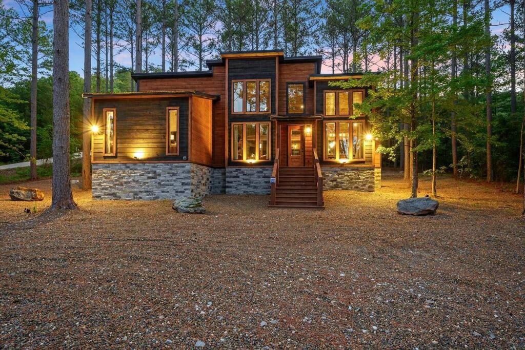 a house in the middle of a forest at Ember Skye Cabin - 2 bdr & Bunk Nook/2.5 bath in Broken Bow