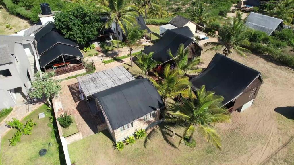 an overhead view of a house with black roofs at Venha Juntos Guest Homes in Miramar
