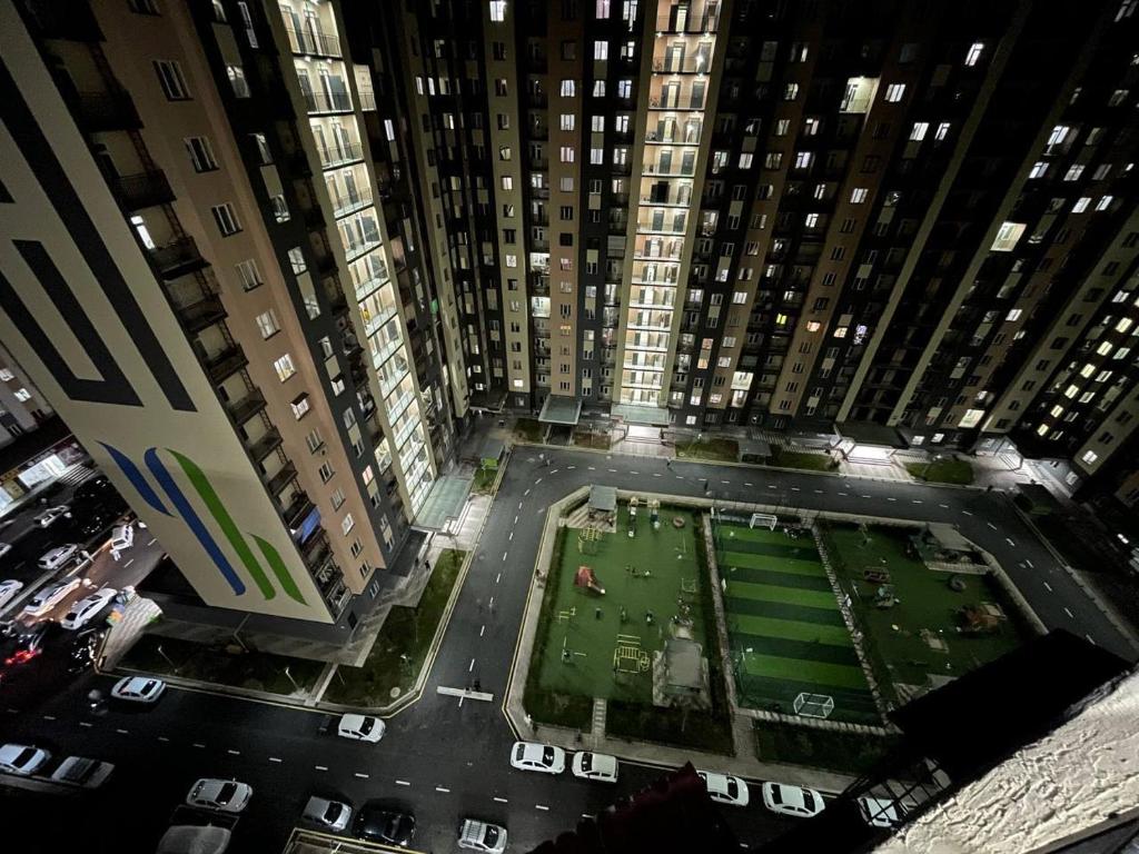 an aerial view of a football field in a city at 3 xona kvartira in Tashkent