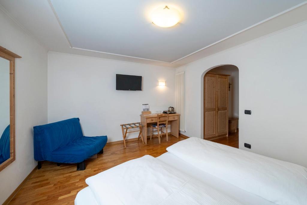 Postel nebo postele na pokoji v ubytování Hotel Erica