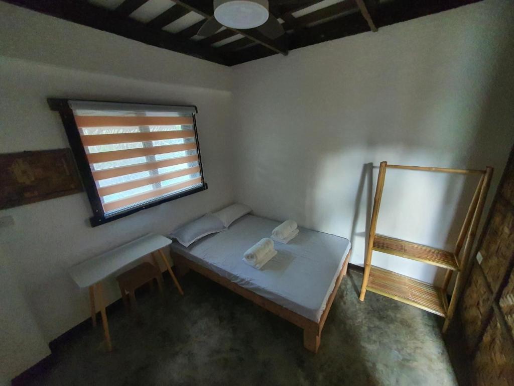 Postel nebo postele na pokoji v ubytování Coleto Siargao