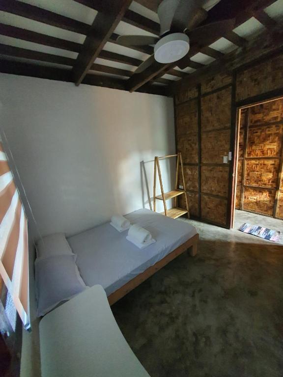 Postel nebo postele na pokoji v ubytování Coleto Siargao