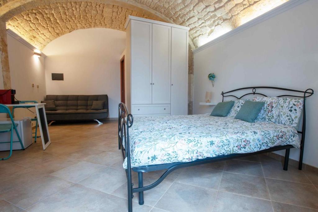 מיטה או מיטות בחדר ב-Domàtio melissa