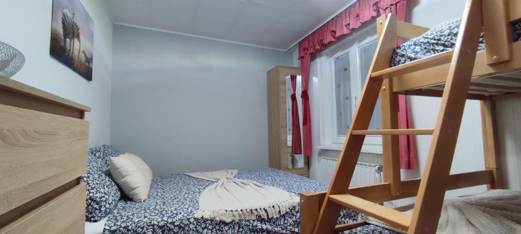 a small room with a bunk bed and a ladder at Apartma Soča Oasis in Srpenica