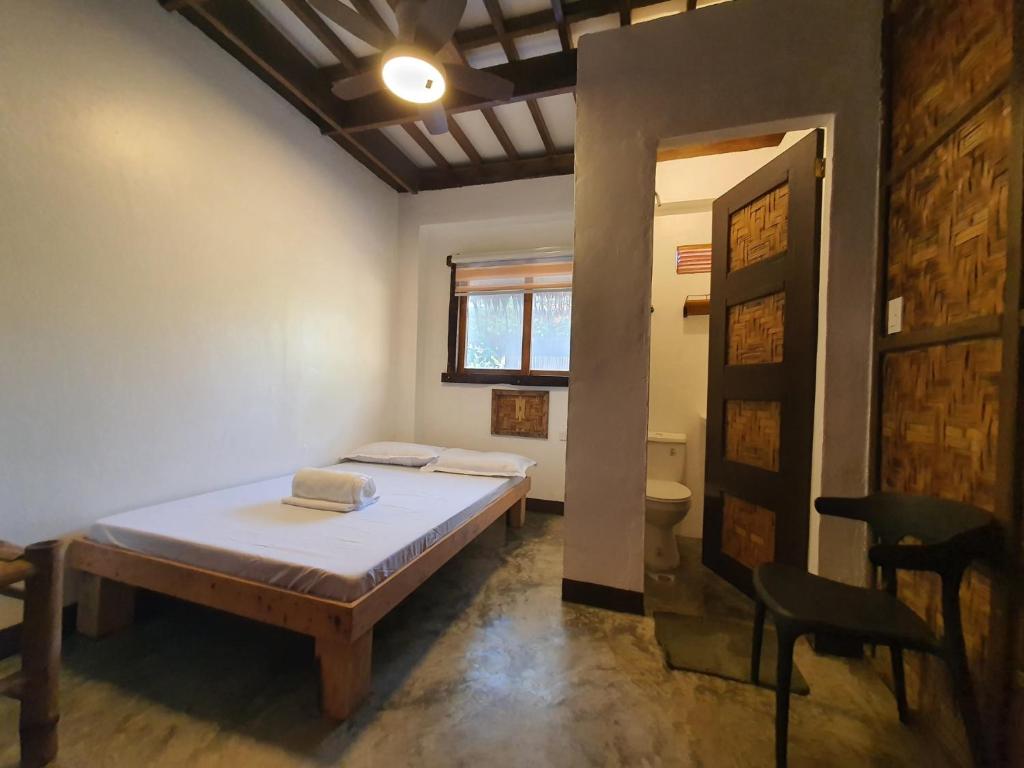 Postel nebo postele na pokoji v ubytování Coleto Siargao