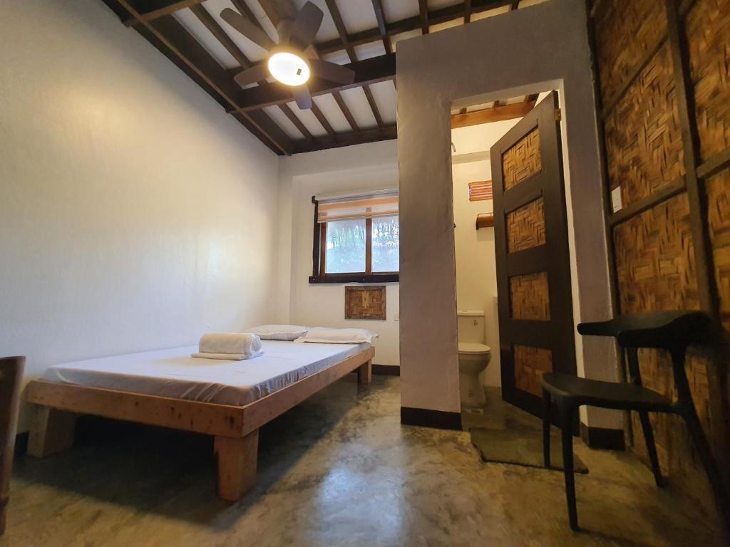 Postel nebo postele na pokoji v ubytování Coleto Siargao