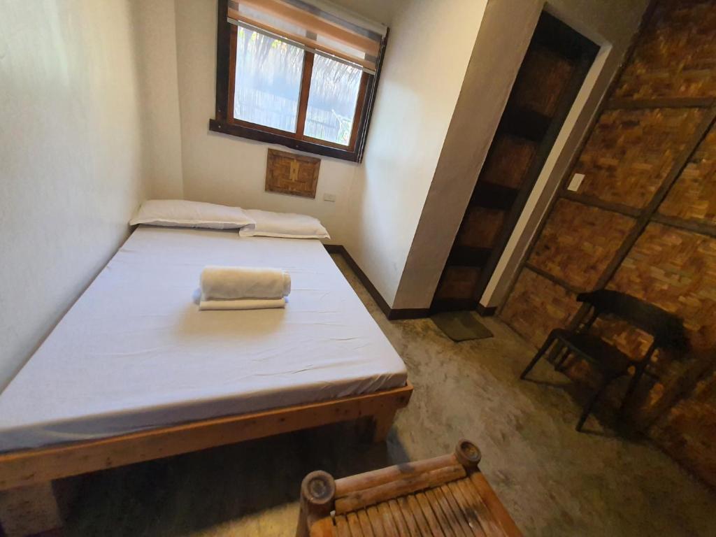Postel nebo postele na pokoji v ubytování Coleto Siargao