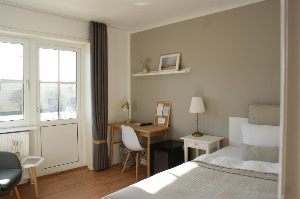 Postel nebo postele na pokoji v ubytování Hotel Strandly Skagen