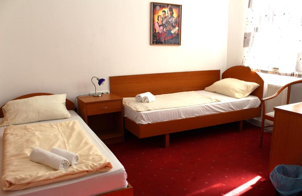 Postel nebo postele na pokoji v ubytování Broadway City Guesthouse